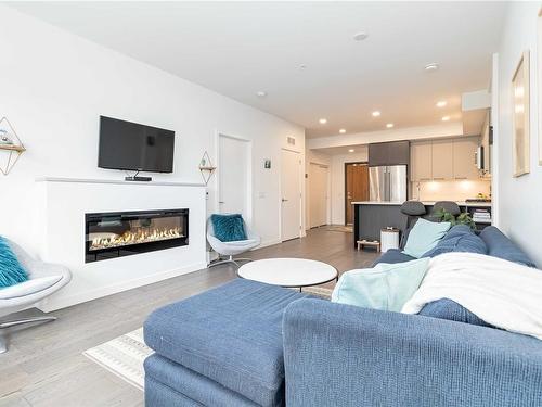 403-7162 West Saanich Rd, Central Saanich, BC - Indoor Photo Showing Living Room With Fireplace