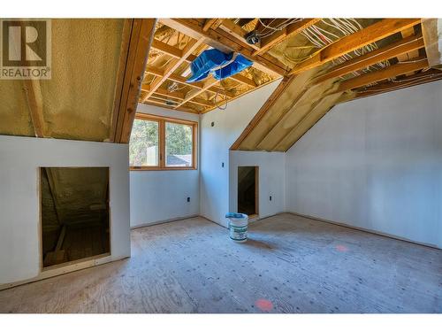 laundry room / walk in closet with storage - 8726 Forsberg Road, Vernon, BC - Indoor Photo Showing Other Room With Fireplace