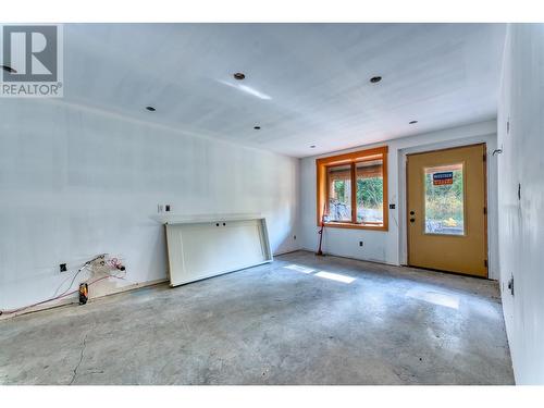 basement / heated floor from wood boiler outside - 8726 Forsberg Road, Vernon, BC - Indoor Photo Showing Other Room