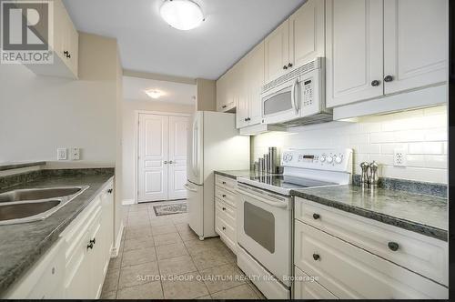 506 - 5070 Fairview Street, Burlington, ON - Indoor Photo Showing Kitchen With Double Sink