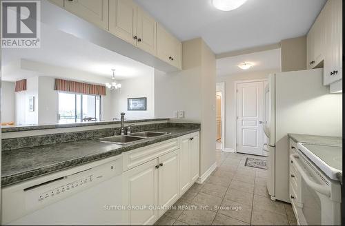 506 - 5070 Fairview Street, Burlington, ON - Indoor Photo Showing Kitchen With Double Sink