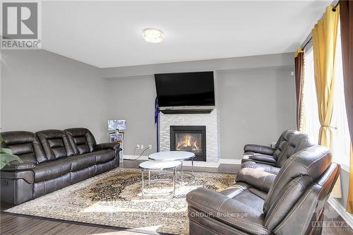 302 Eaglehead Crescent, Ottawa, ON - Indoor Photo Showing Living Room With Fireplace