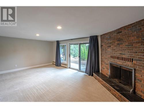 144 Sumac Ridge Drive Unit# 11, Summerland, BC - Indoor Photo Showing Living Room With Fireplace