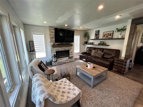 38027 38E (Quarry Oaks) Road, Steinbach, MB - Indoor Photo Showing Living Room With Fireplace