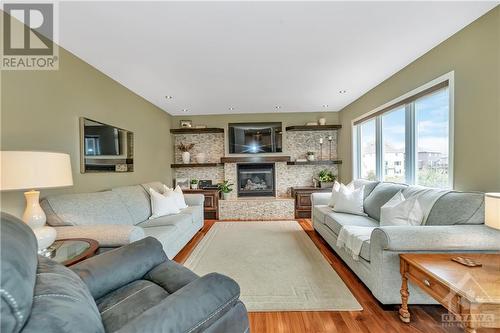 56 Lloydalex Crescent, Ottawa, ON - Indoor Photo Showing Living Room With Fireplace