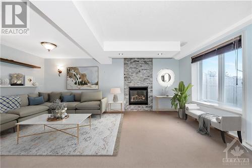 56 Lloydalex Crescent, Ottawa, ON - Indoor Photo Showing Living Room With Fireplace