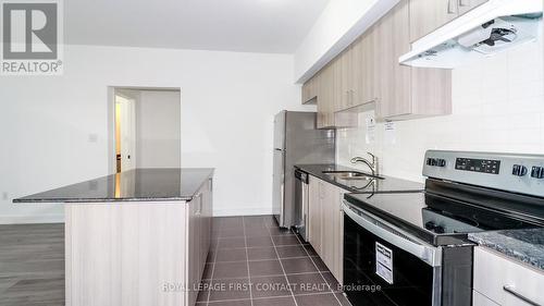 110 - 4 Spice Way, Barrie, ON - Indoor Photo Showing Kitchen With Double Sink