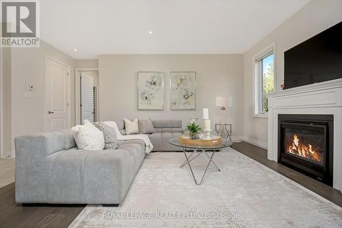 164 Harpin Way E, Centre Wellington, ON - Indoor Photo Showing Living Room With Fireplace