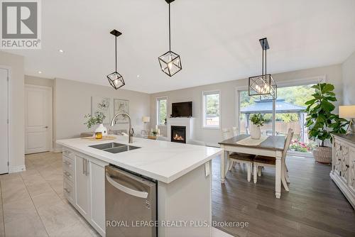 164 Harpin Way E, Centre Wellington, ON - Indoor Photo Showing Other Room With Fireplace