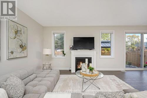 164 Harpin Way E, Centre Wellington, ON - Indoor Photo Showing Living Room With Fireplace