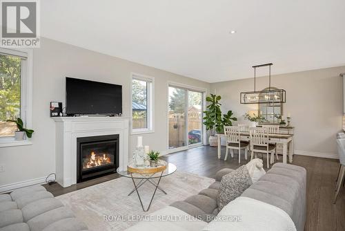 164 Harpin Way E, Centre Wellington, ON - Indoor Photo Showing Living Room With Fireplace