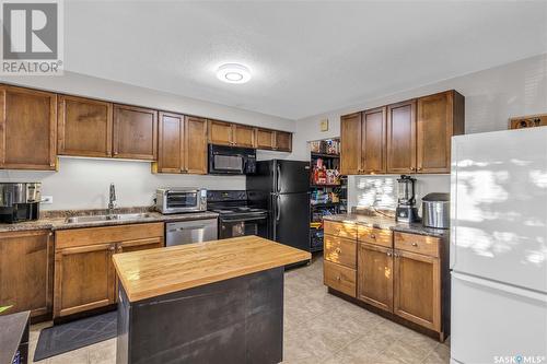 12 210 Camponi Place, Saskatoon, SK - Indoor Photo Showing Kitchen With Double Sink