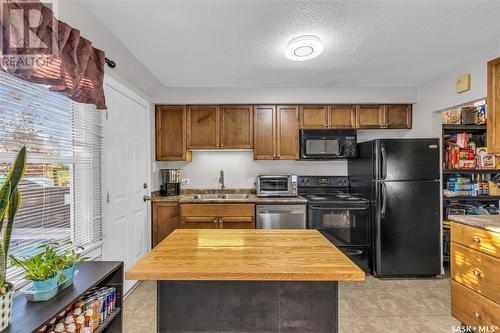 12 210 Camponi Place, Saskatoon, SK - Indoor Photo Showing Kitchen With Double Sink