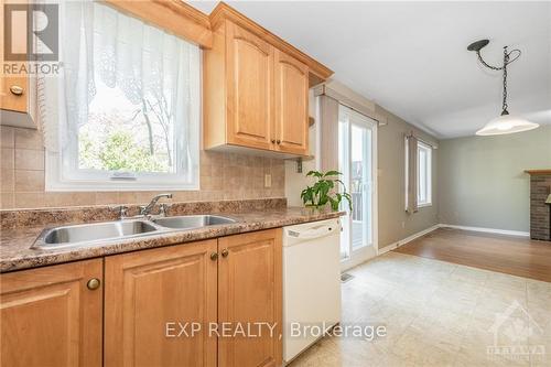 3754 Autumnwood Street, Ottawa, ON - Indoor Photo Showing Kitchen With Fireplace With Double Sink