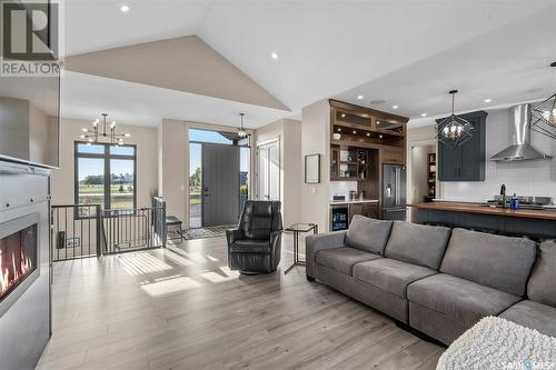 65 Grandview Trail, Corman Park Rm No. 344, SK - Indoor Photo Showing Living Room With Fireplace