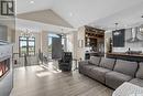 65 Grandview Trail, Corman Park Rm No. 344, SK  - Indoor Photo Showing Living Room With Fireplace 