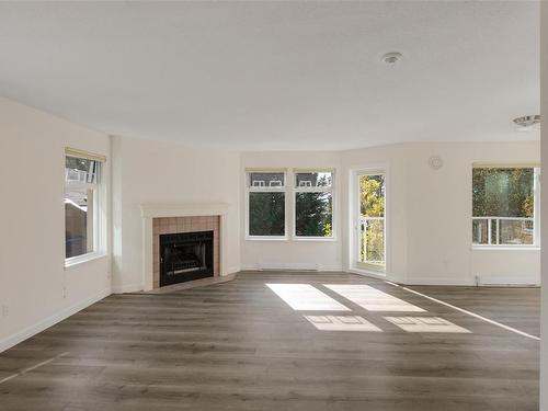 301C-4678 Elk Lake Dr, Saanich, BC - Indoor Photo Showing Living Room With Fireplace