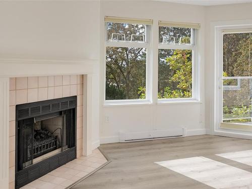 301C-4678 Elk Lake Dr, Saanich, BC - Indoor Photo Showing Living Room With Fireplace