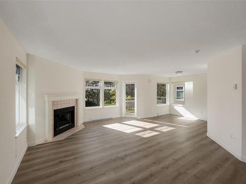 301C-4678 Elk Lake Dr, Saanich, BC - Indoor Photo Showing Living Room With Fireplace