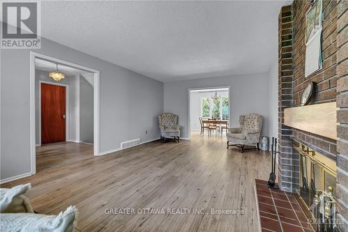 15 Rutherford Crescent, Ottawa, ON - Indoor Photo Showing Living Room With Fireplace