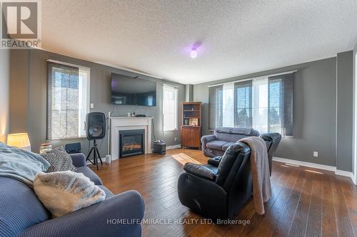 2 Kennedy Boulevard, New Tecumseth, ON - Indoor Photo Showing Living Room With Fireplace