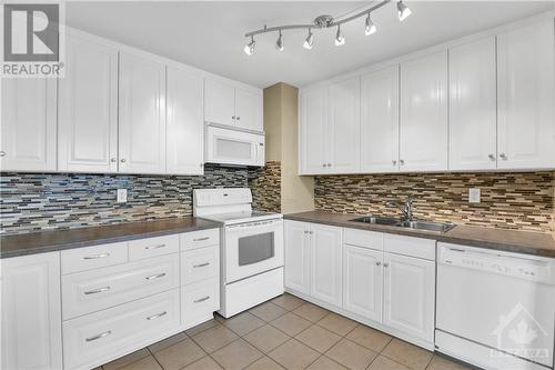 Kitchen - 2951 Riverside Drive Unit#707, Ottawa, ON - Indoor Photo Showing Kitchen With Double Sink