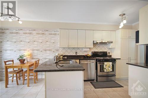 105 Rustwood, Barrhaven (7708 - Barrhaven - Stonebridge), ON - Indoor Photo Showing Kitchen With Stainless Steel Kitchen With Double Sink