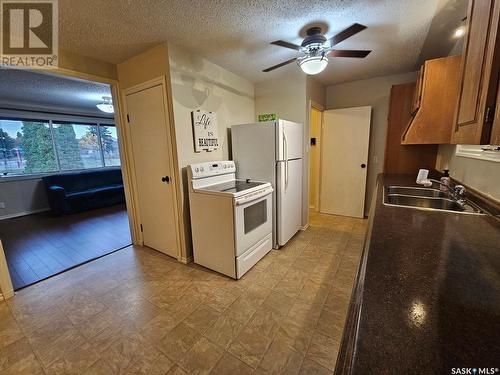 609 1St Street W, Meadow Lake, SK - Indoor Photo Showing Kitchen With Double Sink