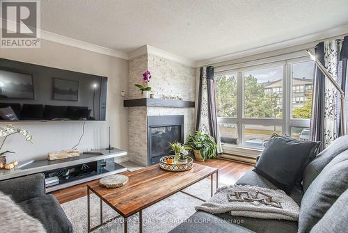 202 - 9 Jacksway Crescent, London, ON - Indoor Photo Showing Living Room With Fireplace