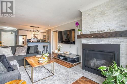 202 - 9 Jacksway Crescent, London, ON - Indoor Photo Showing Living Room With Fireplace