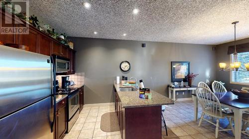 300 Bighorn Boulevard Unit# 324, Radium Hot Springs, BC - Indoor Photo Showing Kitchen With Stainless Steel Kitchen