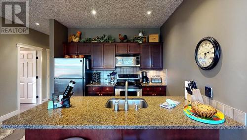 300 Bighorn Boulevard Unit# 324, Radium Hot Springs, BC - Indoor Photo Showing Kitchen With Double Sink