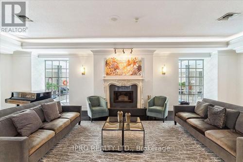 613 - 55 Kingsbridge Garden Circle, Mississauga, ON - Indoor Photo Showing Living Room With Fireplace