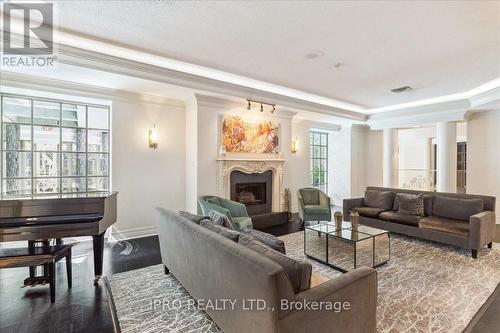 613 - 55 Kingsbridge Garden Circle, Mississauga, ON - Indoor Photo Showing Living Room With Fireplace