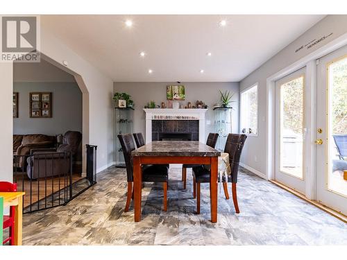 9588 Old Summit Lake Road, Prince George, BC - Indoor Photo Showing Dining Room With Fireplace