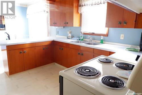 716 4Th Street E, Assiniboia, SK - Indoor Photo Showing Kitchen With Double Sink