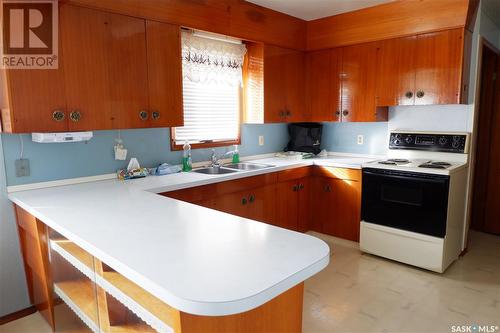 716 4Th Street E, Assiniboia, SK - Indoor Photo Showing Kitchen With Double Sink