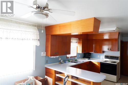 716 4Th Street E, Assiniboia, SK - Indoor Photo Showing Kitchen With Double Sink