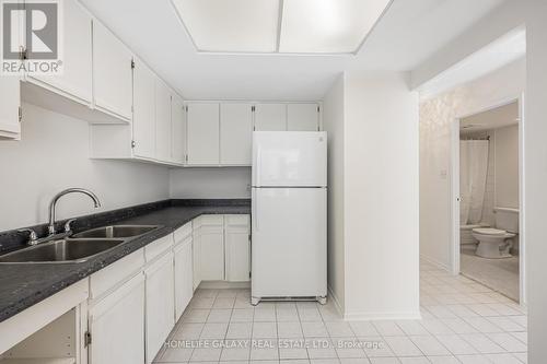 105 - 20 Dean Park Road, Toronto, ON - Indoor Photo Showing Kitchen With Double Sink