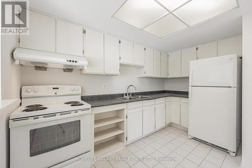 105 - 20 Dean Park Road, Toronto, ON - Indoor Photo Showing Kitchen With Double Sink