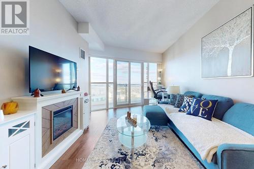 3902 - 50 Absolute Avenue, Mississauga, ON - Indoor Photo Showing Living Room With Fireplace