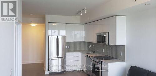 4709 - 30 Shore Breeze Drive, Toronto, ON - Indoor Photo Showing Kitchen With Upgraded Kitchen