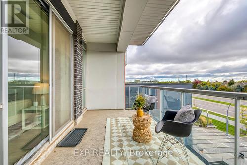 208 - 3028 Creekshore Common S, Oakville, ON - Outdoor With Balcony With Exterior