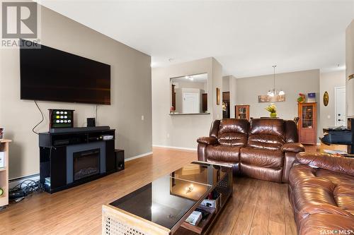 100W 1300 Stockton Street N, Regina, SK - Indoor Photo Showing Living Room With Fireplace