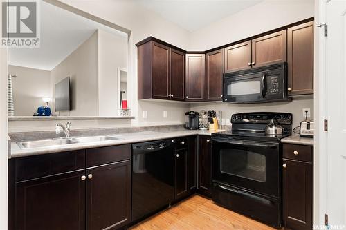 100W 1300 Stockton Street N, Regina, SK - Indoor Photo Showing Kitchen With Double Sink