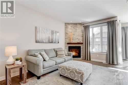 Family Room with Fireplace - 816 Loosestrife Way, Ottawa, ON - Indoor Photo Showing Living Room With Fireplace