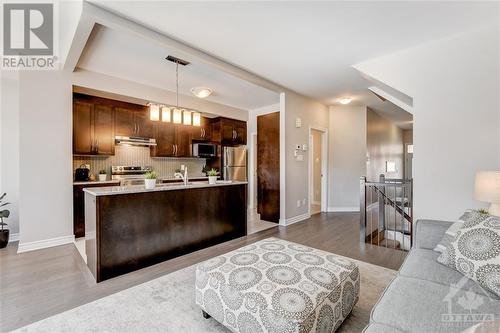 Open Concept Living, Dining, Kitchen with Nat Gas Fireplace - 816 Loosestrife Way, Ottawa, ON - Indoor Photo Showing Kitchen