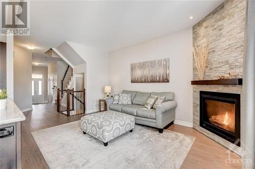 Open Concept Living, Dining, Kitchen with Nat Gas Fireplace - 816 Loosestrife Way, Ottawa, ON - Indoor Photo Showing Living Room With Fireplace