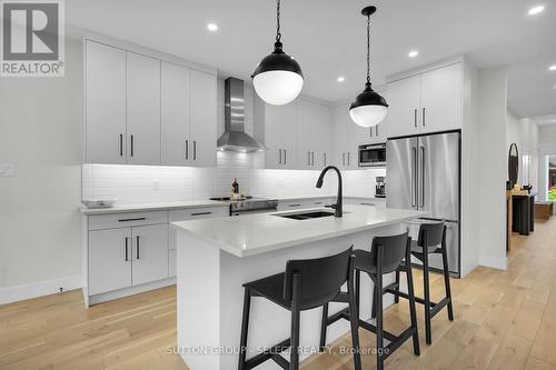 145 Collins Way, Strathroy-Caradoc (Se), ON - Indoor Photo Showing Kitchen With Double Sink With Upgraded Kitchen