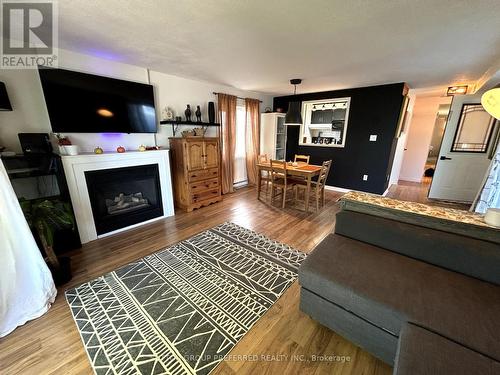 5 - 450 Tremaine Avenue S, North Perth (32 - Listowel), ON - Indoor Photo Showing Living Room With Fireplace